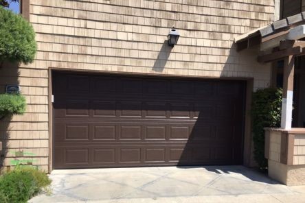 Side-by-side comparison showing the dramatic improvement from the old garage door to the new installation on a Dallas home.