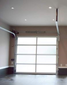 Arlington garage with sleek frosted glass overhead doors fully closed – inside view