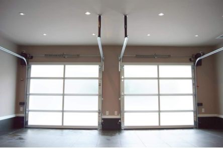 Arlington garage with sleek frosted glass overhead doors fully closed – inside view