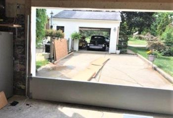 View from inside garage showing new garage door installation in progress – Cedar Hill residential service